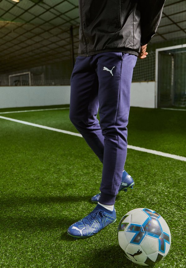 Puma TEAMGOAL CASUALS PANTS - Tracksuit bottoms - navy
