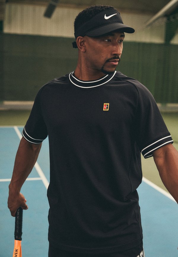 Nike Performance HERITAGE - Sports T-shirt - black