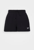 Schwarze Baumwollshorts mit einem elastischen Bund und Kordelzug. Merkmale eine kleine weiße "tommy jeans"-Stickerei am Saum. Glatte Textur.