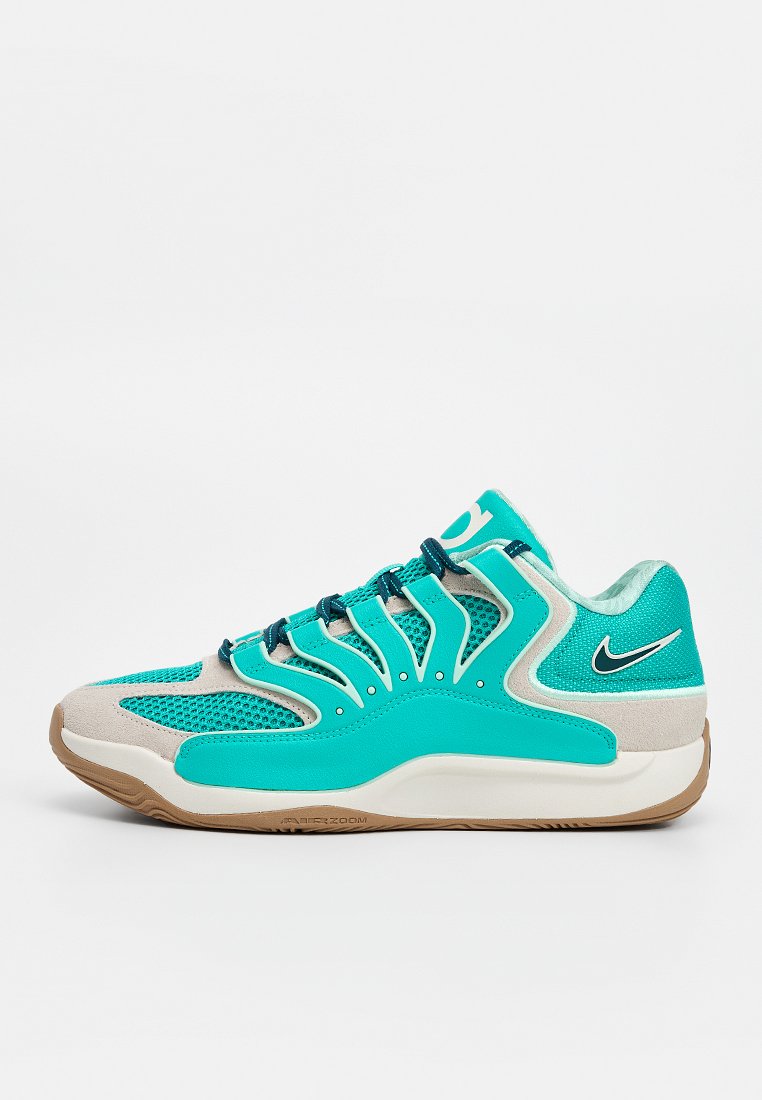 Türkisfarbener und beiger Nike Sportschuh mit Mesh-Einsätzen, schwarzen Schnürsenkeln, gepolsterter Sohle und Nike-Swoosh-Logo an Ferse und Zunge.