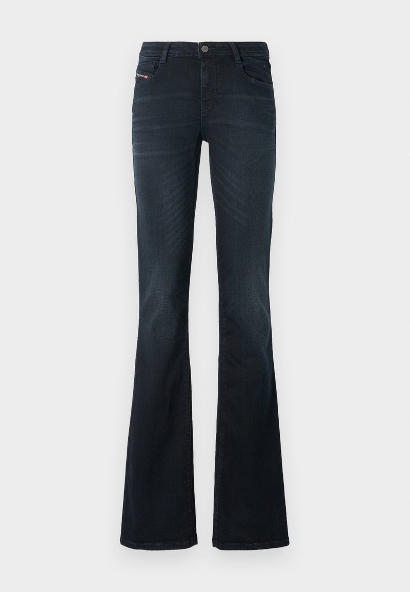 Schlanke Jeans aus dunkelblauem Denim mit glatter Textur, fünf Taschen-Design und einem Knopfverschluss am Bund. Merkmale sind dezente Nähte.