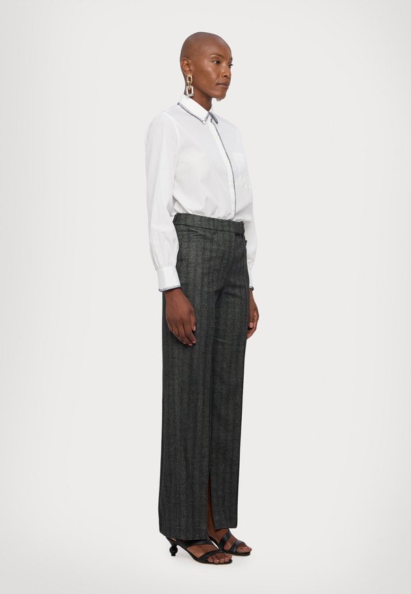 REMAIN STRIPED SLIM PANTS