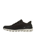 Schwarzer Sneaker mit niedrigem Schaft, gesteppter Oberseite, Schnürverschluss und dicker weißer Sohle mit mehreren Luftpolster-Einheiten.