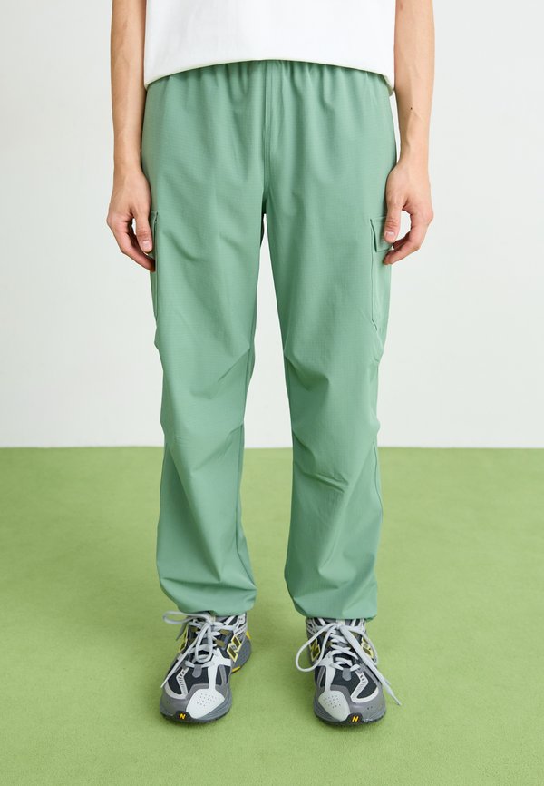 New Balance RIPSTOP - Cargo trousers - dark juniper
