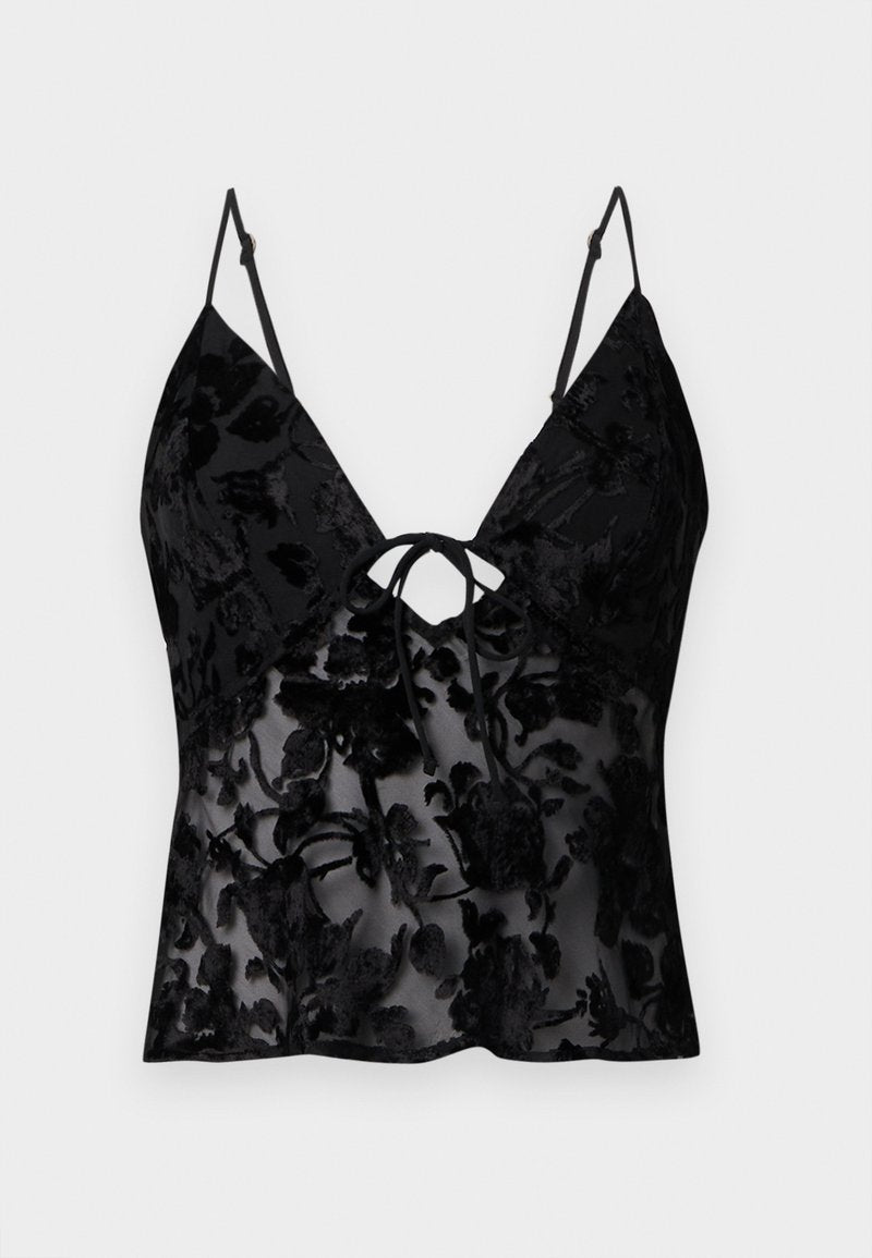 Schwarzes Camisole mit dünnen Trägern, das ein florales Muster aus Samt-Overlay auf durchsichtiger Stoff hat; V-Ausschnitt und Bindebanddetails vorne.