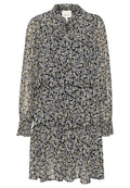 Blumenkleid aus leichtem schwarzen Stoff mit blauen und gelben Blumen, mit rüschendem Saum, langen Ärmeln und einer geknöpften Halsschleife.