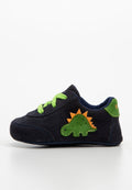 Marineblaues Wildlederschuh für Kinder mit grünem Dinosaurier-Applikation, orangen Stacheln und grünen Schnürsenkeln. Das Modell bietet gestickte Details und eine strukturierte Sohle.