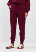 Calvin Klein SLIM FIT - Tracksuit bottoms - e berry glaze