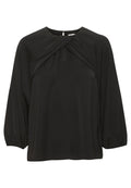 Schwarze Bluse mit langen Ärmeln, raffinierten Bündchen und einem gewundenen, drapierten Ausschnitt, aus glattem Stoff gefertigt.