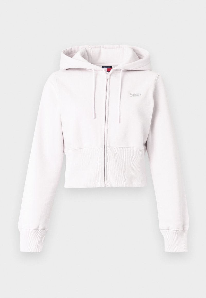 Kurz geschnittener, hellrosa Hoodie aus weichem Stoff, mit durchgehendem Reißverschluss, Kordelzug an der Kapuze und gerippten Bündchen. Dezentes Logo auf der Brust.