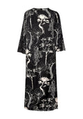 Schwarzes, langärmliges Midikleid mit weißen abstrakten Baummustern, Rundhalsausschnitt und lockerer Passform.