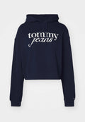 Marineblauer verkürzter Kapuzenpullover aus Baumwolle, mit einem weißen "tommy jeans" Logo, einer Kordelzugkapuze und gerippten Bündchen.