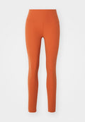Hochtaillierte Leggings in einem einheitlichen Orangeton, aus einem dehnbaren, glatten Stoff gefertigt. Eng anliegendes Design ohne sichtbare Muster oder Akzente.