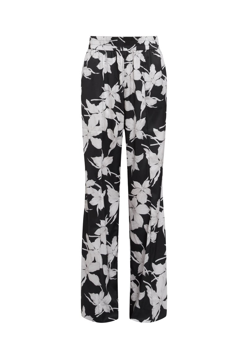 Schwarzblumige Hose mit lockerer Passform. Verfügt über weiße Blumenmuster und einen elastischen Bund. Hergestellt aus glattem, leichtem Stoff.