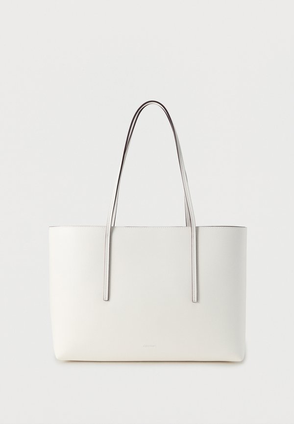 Calvin Klein FOIL LOGO TOTE POUCH - Tote bag - white alyssum
