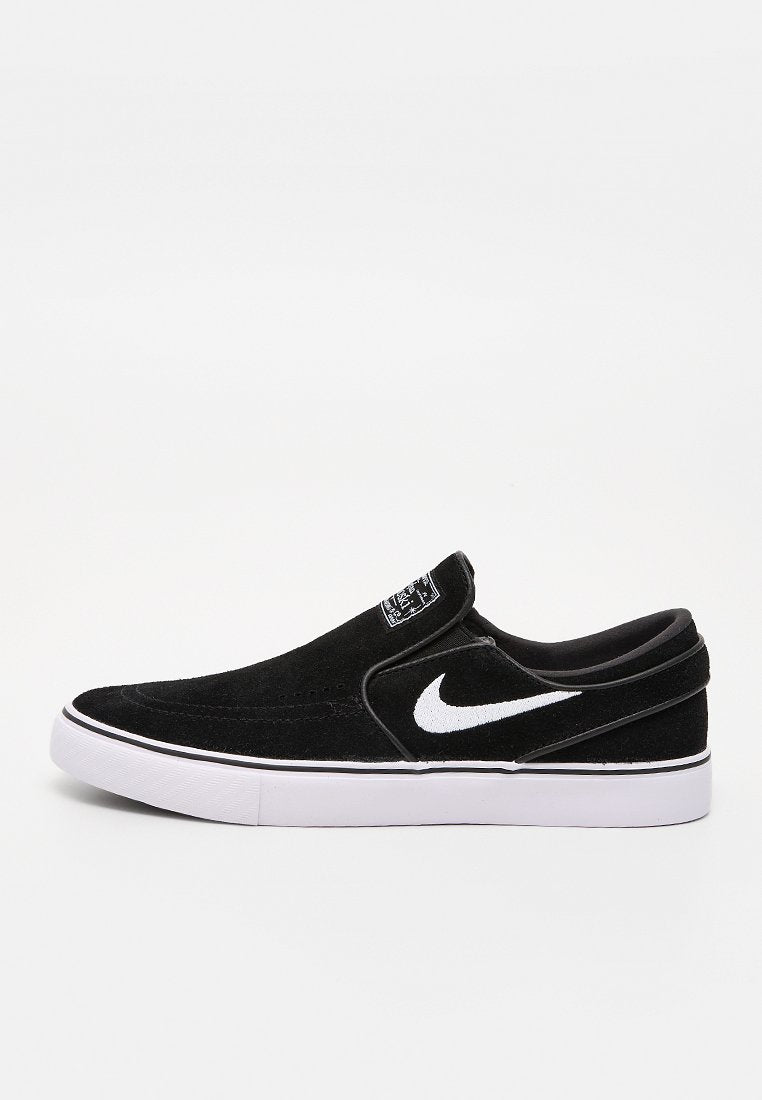 Schwarze Slipper-Sneaker aus Wildleder mit weißem Nike-Swoosh, weißer Sohle und strukturiertem Obermaterial. Verfügt über einen gepolsterten Kragen und ein minimalistisches Design.