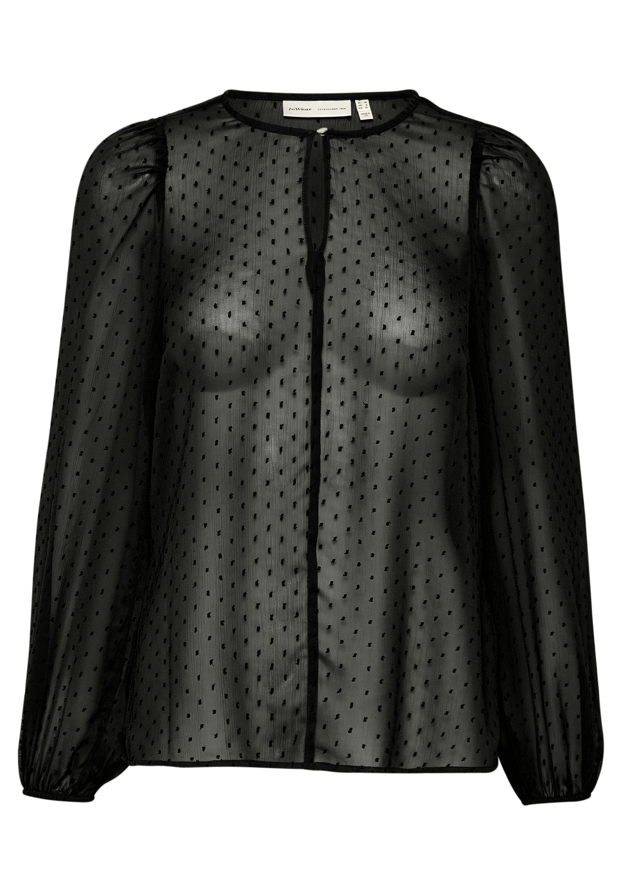Schwarze transparente Bluse mit Punktemuster, langen Puffärmeln, rundem Ausschnitt und zentralem Knopfverschluss. Weicher, leichter Stoff.