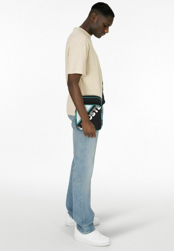Lacoste BREWEN 19.5 CM - Cross body bag - abimes farine bayou