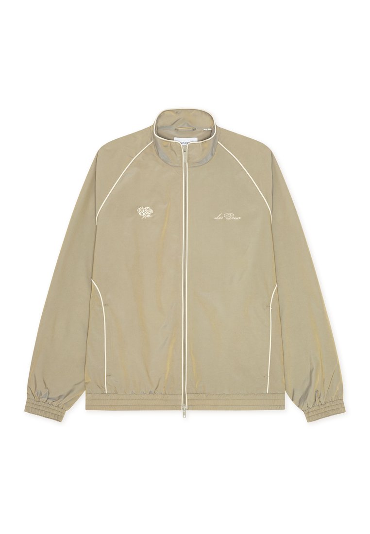 Beige Jacke mit hohem Kragen, Reißverschluss vorne und weißen Akzentnähten. Mit Logo-Stickerei auf der linken Brust und elastischen Bündchen.
