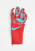 Rot und blau gemusterter Nike Torwarthandschuh mit verlängertem Handgelenkbund auf weißem Hintergrund.