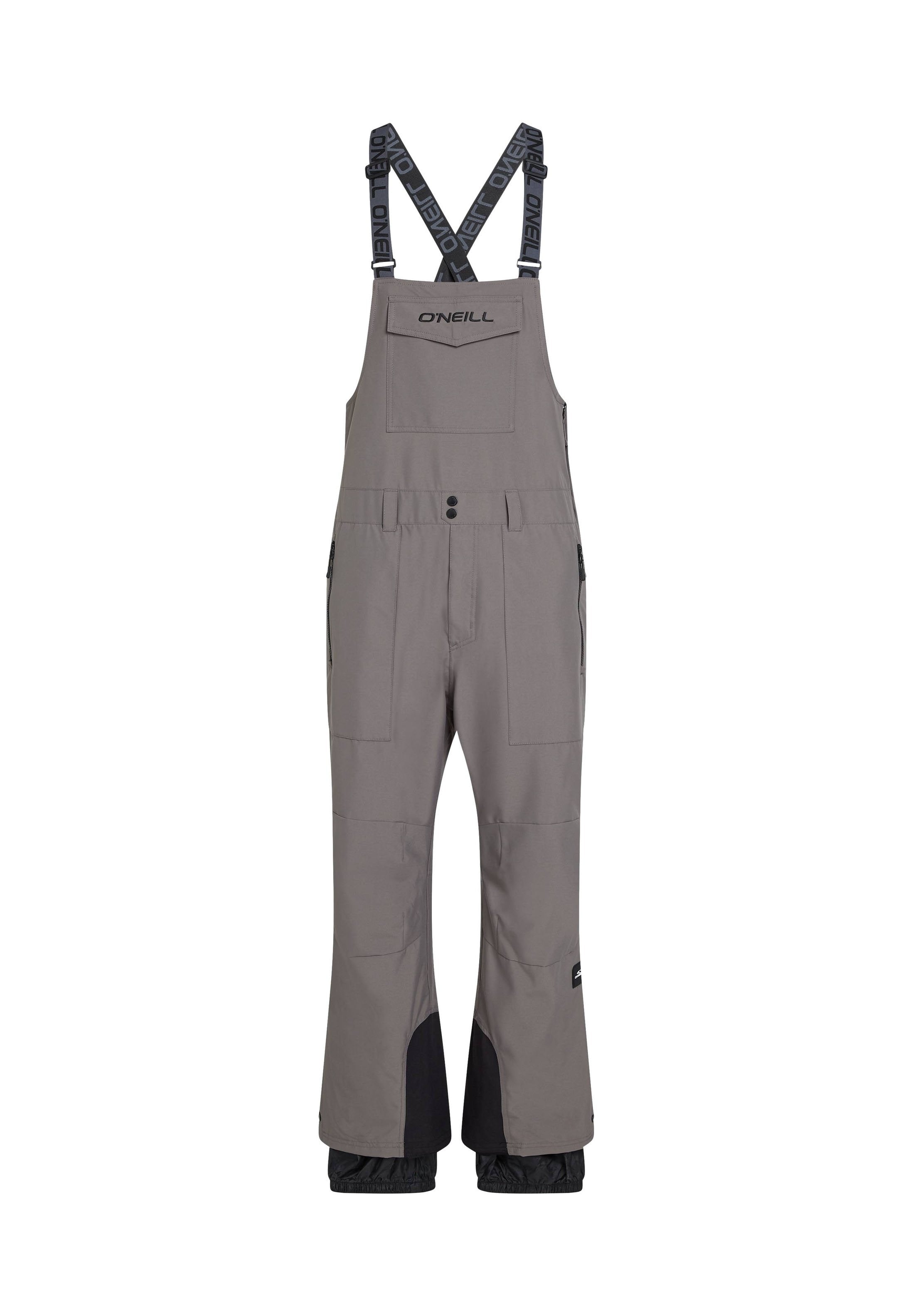 Grau wasserfester Overall mit verstellbaren Trägern, mehreren Taschen, verstärkten Knien und schwarzen Akzenten an den Unterschenkeln. Markenlogo auf der Brust.
