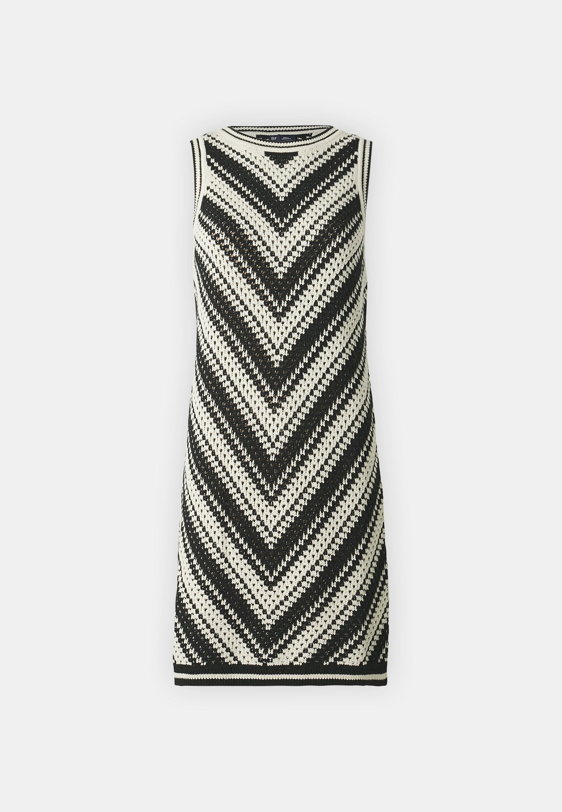 Strickkleid ohne Ärmel mit einem schwarz-weißen Zickzackmuster, angedeutetem Halsausschnitt und Saum. Stilvolles, strukturiertes und figurbetontes Design.