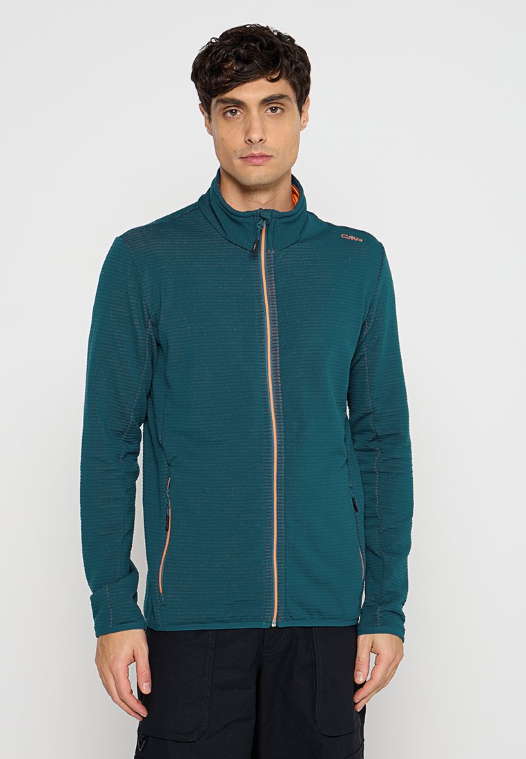 Dunkelblaugrüne Zip-Jacke aus strukturiertem Stoff mit orangen Akzenten. Hoher Kragen, lange Ärmel und mit Reißverschluss gesicherte Seitentaschen.