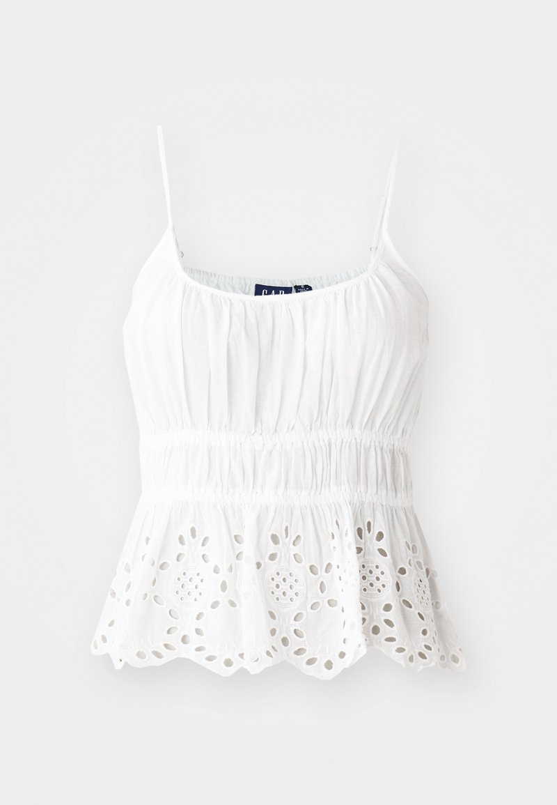 Weißes Baumwoll-Camisole mit verstellbaren Trägern, gerafftem Oberteil und einem gewellten Saum mit gestickten floralem Durchbrüchen.