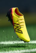 New Balance FURON V8 PRO MG - Football boots artificial grass - punch yellow/black 100/fire cracker