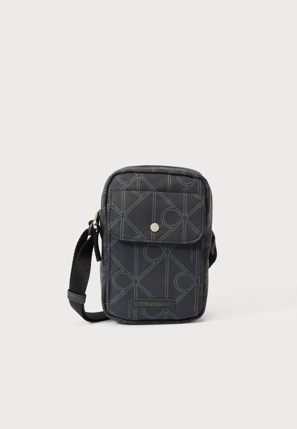 Calvin Klein REPORTER - Cross body bag - black