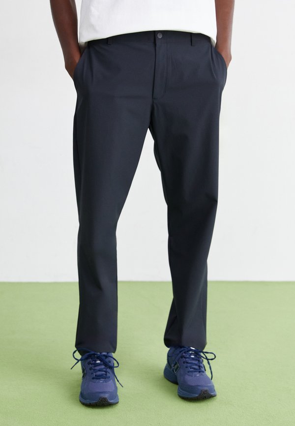 New Balance ATHLETICS RIPSTOP STANDARD TAPERED PANT 30" - Trousers - black
