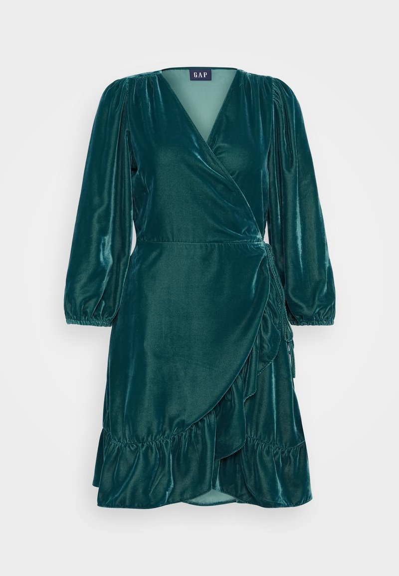 Türkiser Samt-Wickelkleid mit langen Puffärmeln, V-Ausschnitt, Volant-Saum und verstellbarem Bindeband in der Taille. Glatte Textur, elegantes Design.