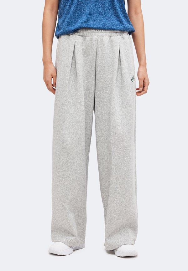 Under Armour RIVAL PLEATED VARSITY - Tracksuit bottoms - mod gray light heather/arden green