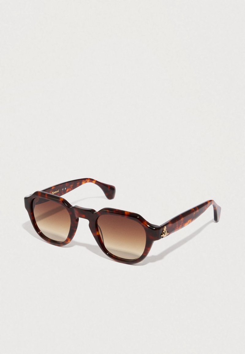 Sonnenbrille im Schildpattmuster mit quadratischer Form, Verlaufsgläsern und einem goldenen Logoakzent am Bügel. Glattes, glänzendes Kunststoffmaterial.