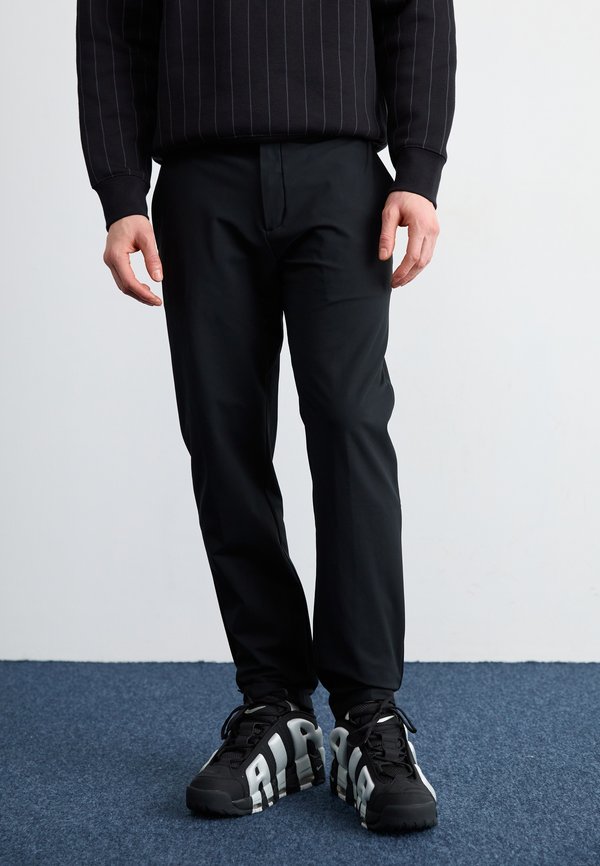 Nike Sportswear 24.7 PERFECTSTRETCH - Chinos - black