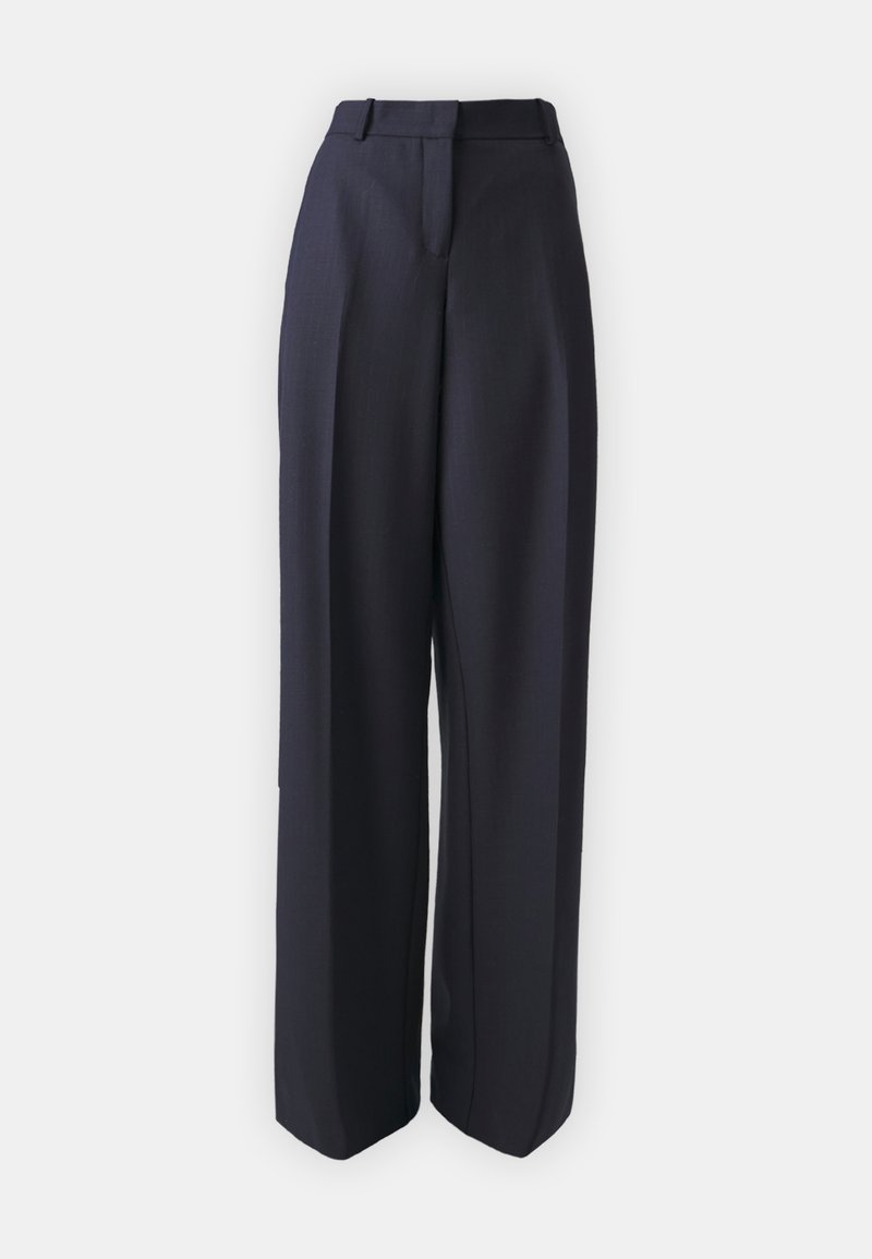 Dunkelblauwe weit geschnittene Hose aus strukturiertem Stoff, mit hohem Bund, scharfen Falten und seitlichen Taschen für zusätzliche Funktionalität.