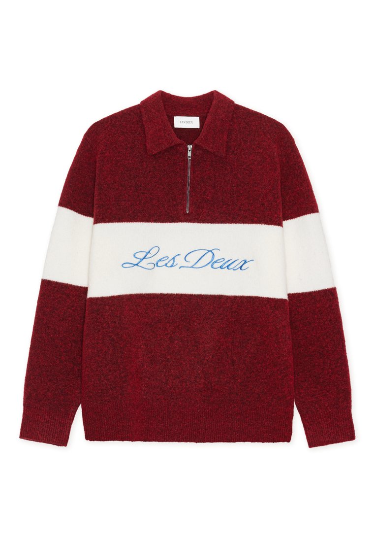 Rot-weißes Pullover mit Blockfarben und einem Reißverschlusskragen, bestickt mit "Les Deux" in Blau. Hergestellt aus weichem, strukturiertem Stoff.