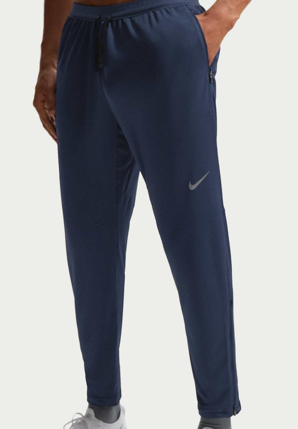 Nike Performance LAUF STRIDE - Tracksuit bottoms - midnight navy