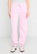 Helle rosa Jogginghose mit einem elastischen Taillenbund und Kordelzug, ausgestattet mit seitlichen Taschen und gerippten Bündchen. Hergestellt aus weichem, strukturiertem Stoff.