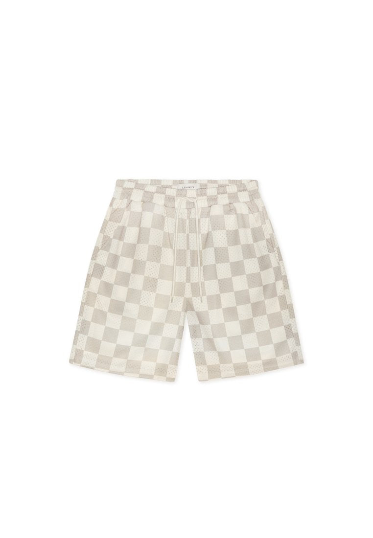 Leicht beige karierte Shorts in entspannter Passform mit einem elastischen Bund, Kordelzug und Seitentaschen. Hergestellt aus atmungsaktivem Stoff.