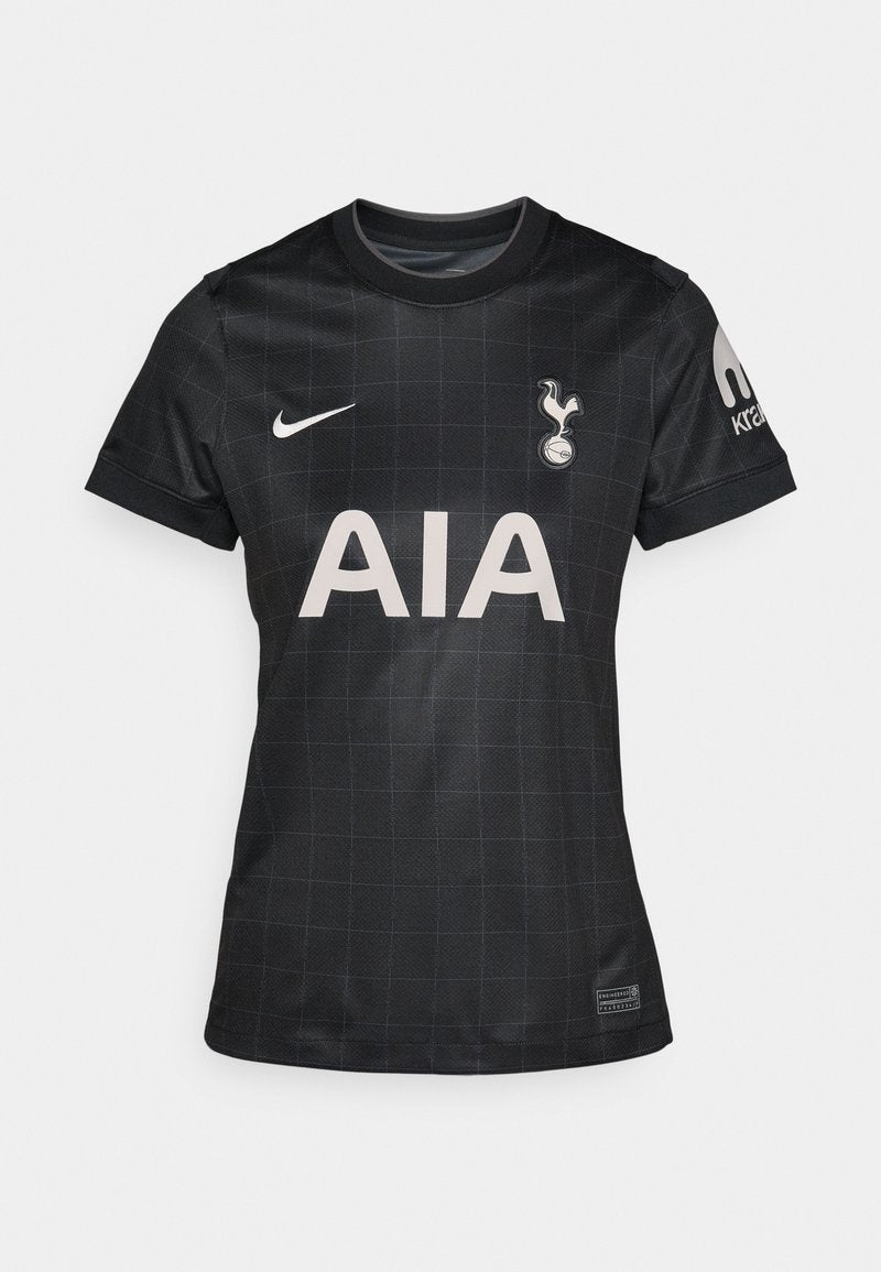 Schwarzes Footballtrikot mit einem Gittermuster, rundem Kragen, kurzen Ärmeln und den Logos von Nike und Tottenham Hotspur.
