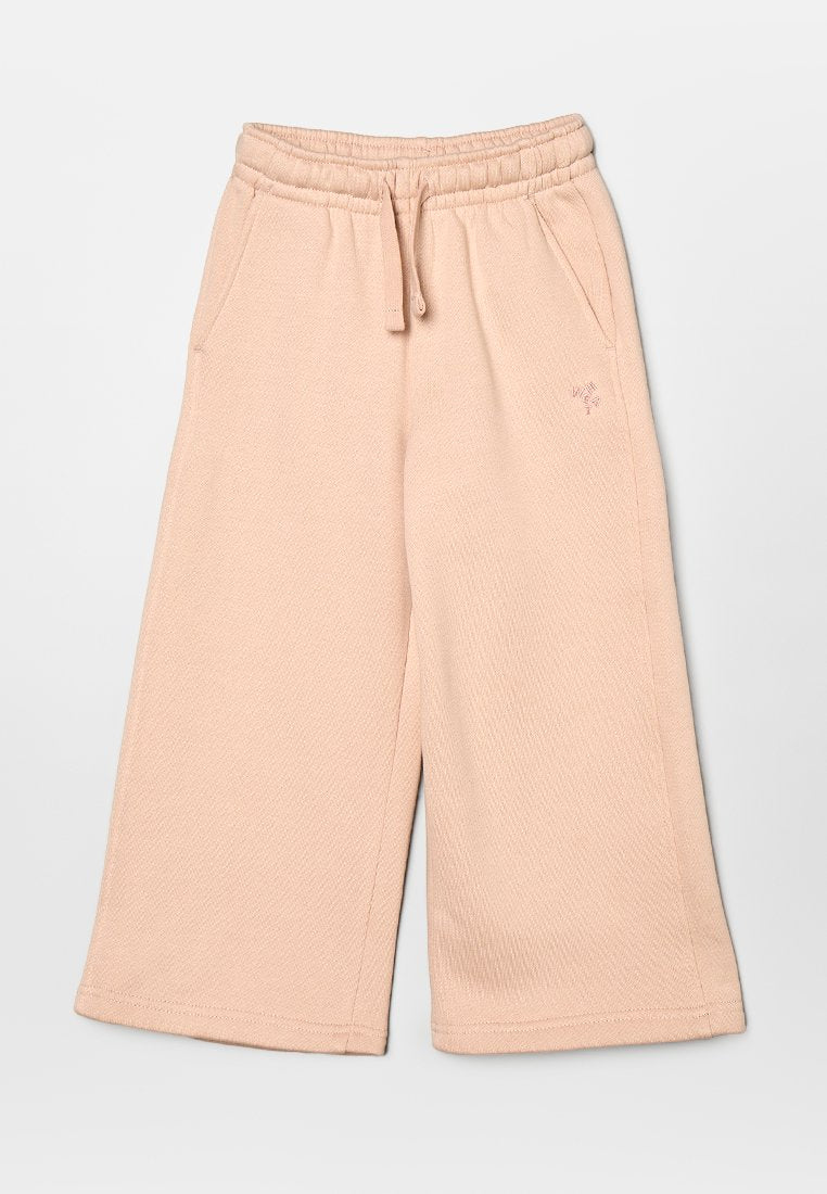 Helle rosa weite Jogginghosen aus strukturiertem Material, mit elastischem Bund, Kordelzug und Seitentaschen.