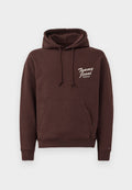 Brauner Hoodie aus weichem Material mit einer Front-Kängurutasche, verstellbarem Kapuzenzug und dem weißen "Tommy Jeans"-Logo. Rippbündchen und Saum.
