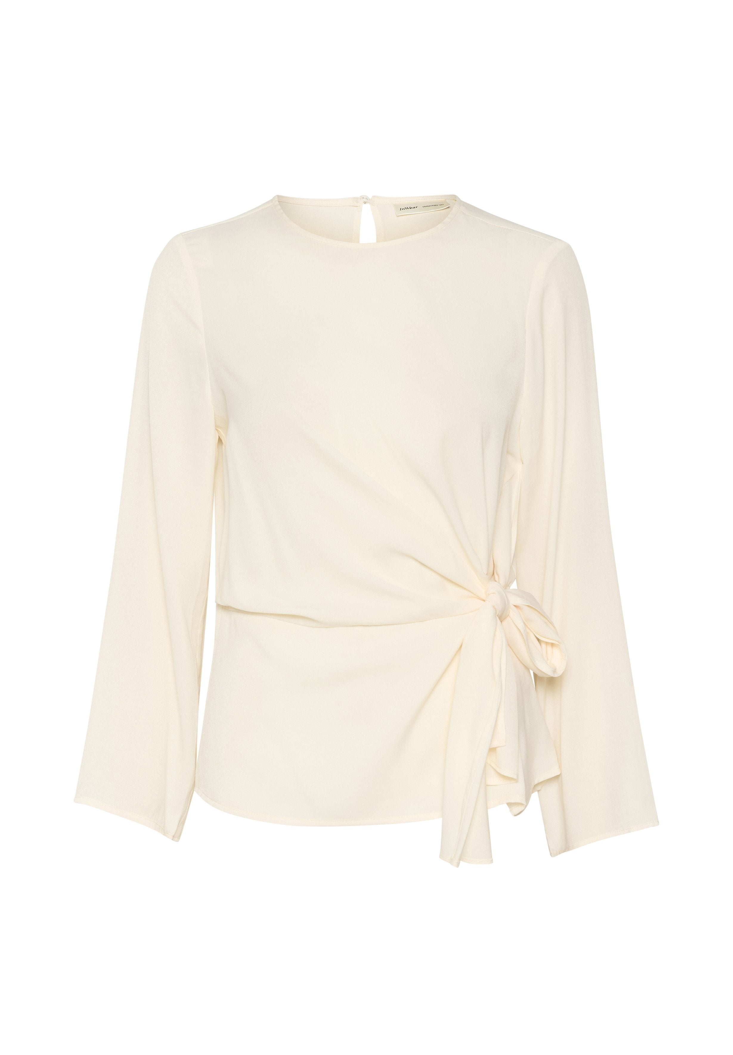 Cremfarbener Wickeloberteil mit langen Ärmeln, Knotendetail an der Taille, rundem Halsausschnitt und einer Schlüssellochöffnung auf der Rückseite. Glattes, leichtes Material.