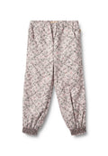 Helle Pink Blumenhose mit elastischem Bund und Rüschenmanschetten. Verfügt über kleine grüne und rosa Blumenmuster im gesamten Stoff. Weiche Stofftextur.