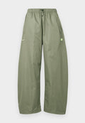 Nike Sportswear Tracksuit bottoms - silver coloured sage/white/volt ice