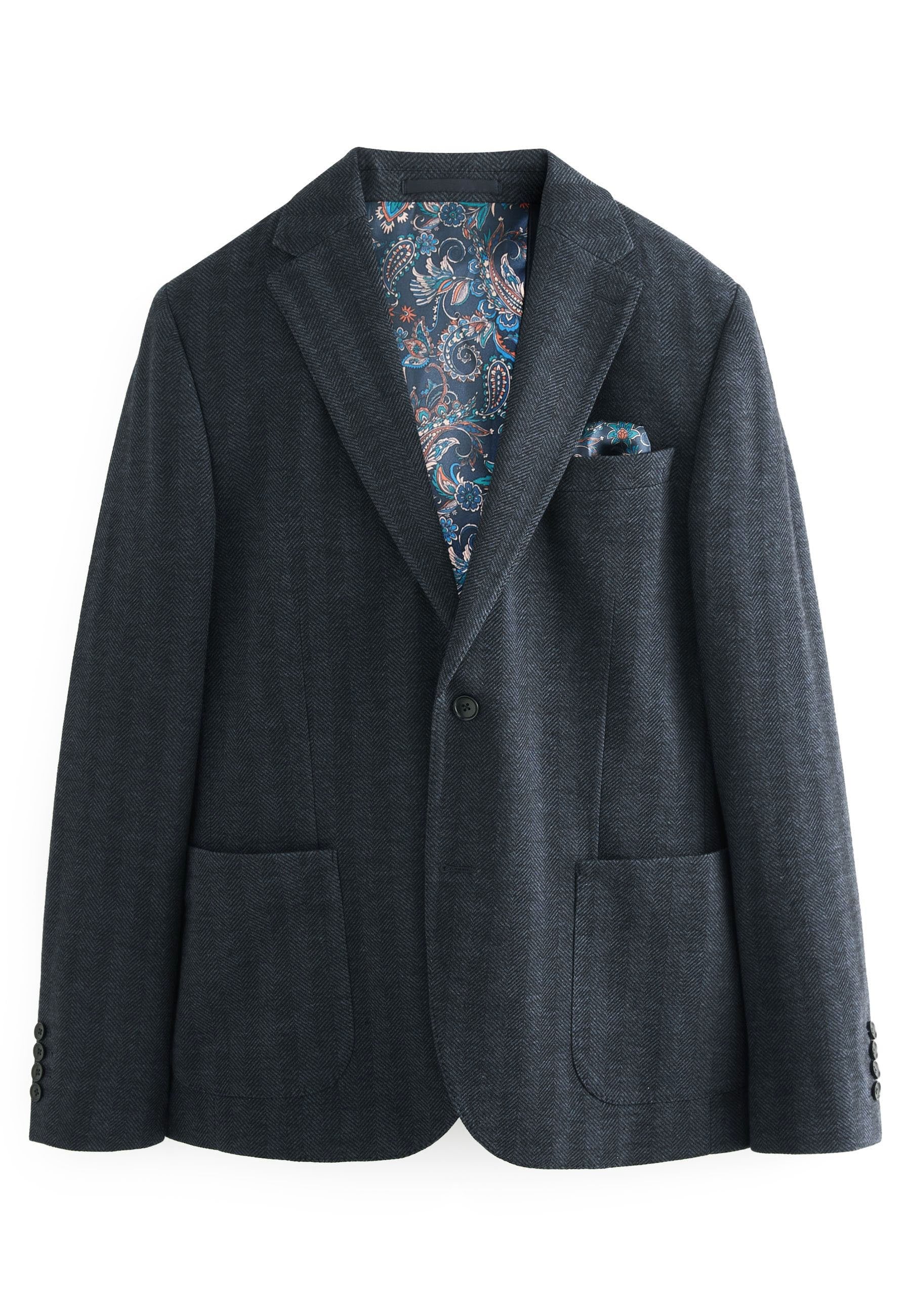 Dunkelgrauer Fischgratblazer mit Revers, zwei vorderen Taschen und einem bunten Paisleymuster-Futter. Vorderer Knopfverschluss.