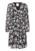 Blumen Kleid mit einem dunklen Marineblau-Hintergrund, verziert mit weißen botanischen Drucken. Es hat einen V-Ausschnitt, lange Ärmel und eine lockere Passform.