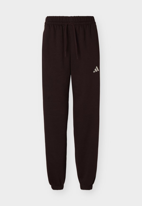 adidas Sportswear ESSENTIALS 3 STRIPES LOOSE PANTS - Tracksuit bottoms - aurora coffee/ivory