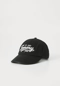 Schwarze Baumwoll-Baseballmütze mit gebogenem Schirm, ausgestattet mit einem weißen gestickten "Tommy Jeans"-Logo und dem Detail "est. 1985" auf der Vorderseite.